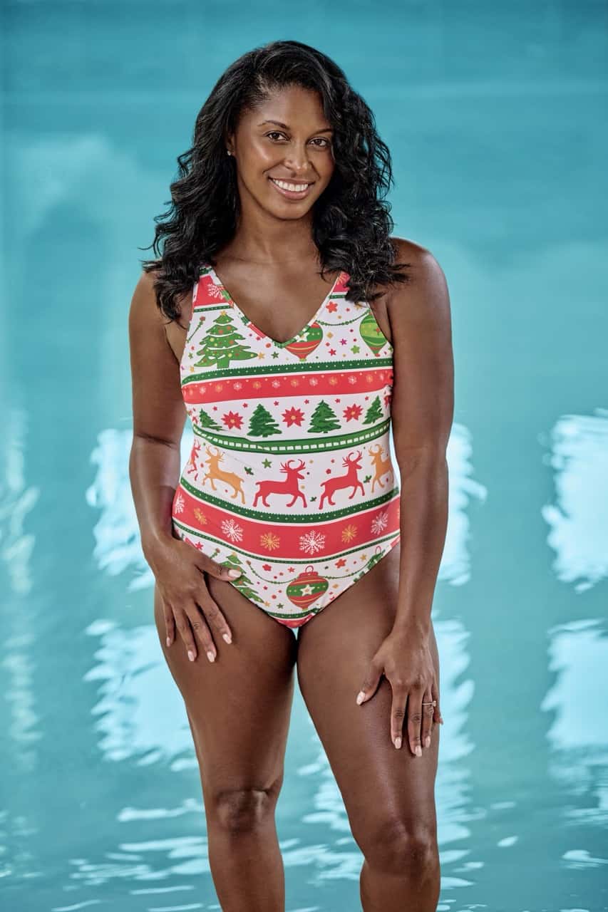 a woman wearing a Holiday themed swimwear in white, green and red color